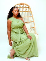 Front view of  green maxi dress is the ultimate easy one-shoulder look. Vibrant and vogue, it can be worn to any event or occasion!  Elastic waist with self-tie belt and side invisible zipper  Dress is lined  100% polyester 
