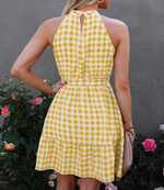 Rear View of Yellow and White Halter Neck Dress, Sleeveless, Gingham, Selft-tie belt, Ruffled hem 100% Polyester