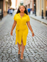 Front view of mustard yellow dress. There is ruching in the front, self tie belt, and buttons down the front as on a shirt. 90% Polyester 10% Spandex