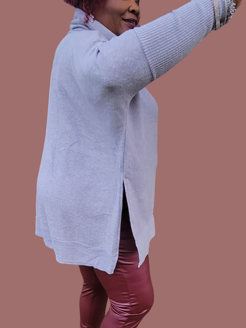 Side view of oversized sweater; 82% polyester; 15% cotton; 3% spandex