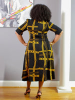 Rear view of black dress with gold chain detail; 100% Polyester