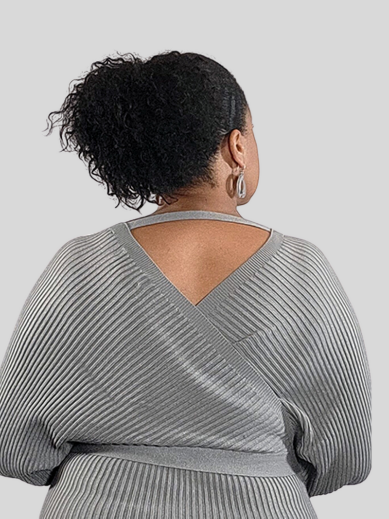 Back view of sweater dress; 50% Viscose; 25% Polyester; 25% Nylon  Edit alt text