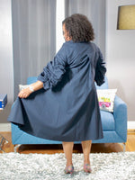 Rear view of navy blue dress with ruched sleeves, 100% cotton