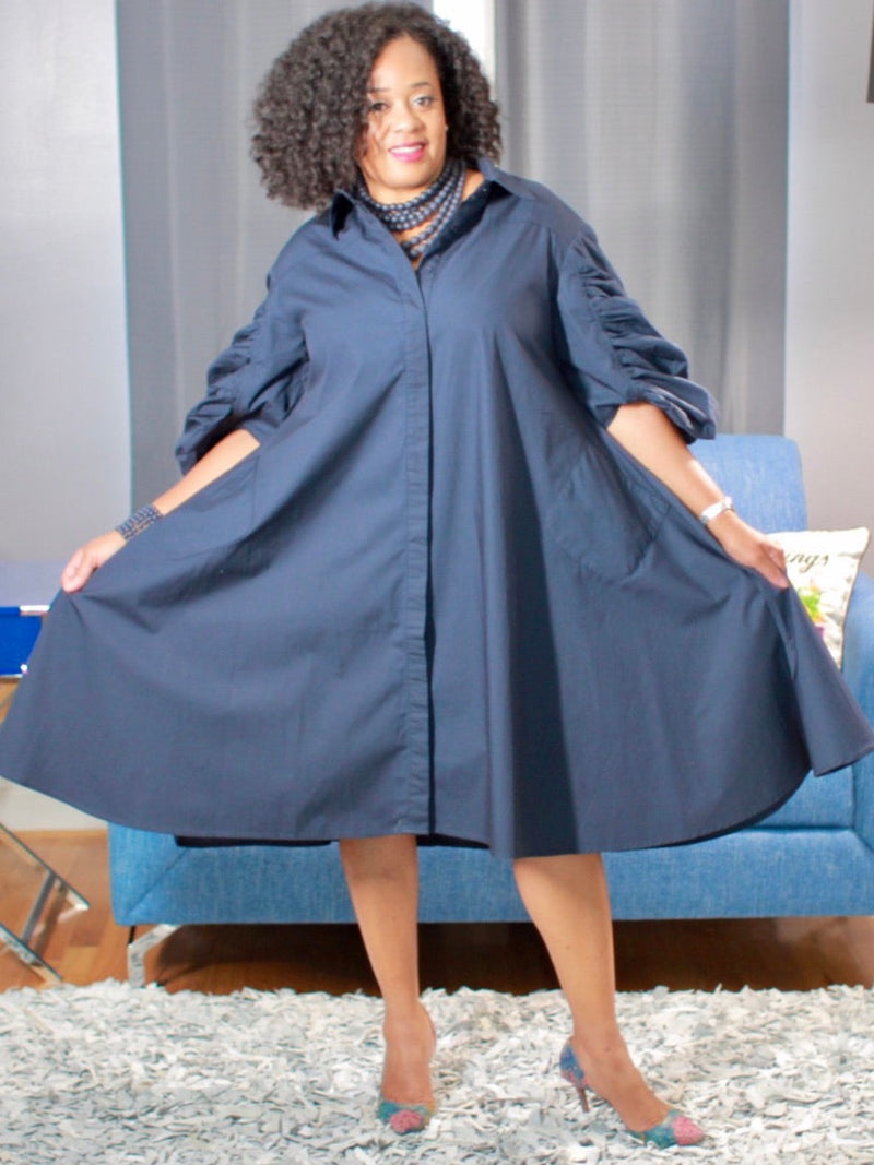 Front view of navy blue dress with ruched sleeves, 100% cotton