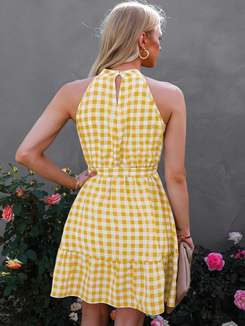 Rear View of Yellow and White Halter Neck Dress, Sleeveless, Gingham, Selft-tie belt, Ruffled hem 100% Polyester